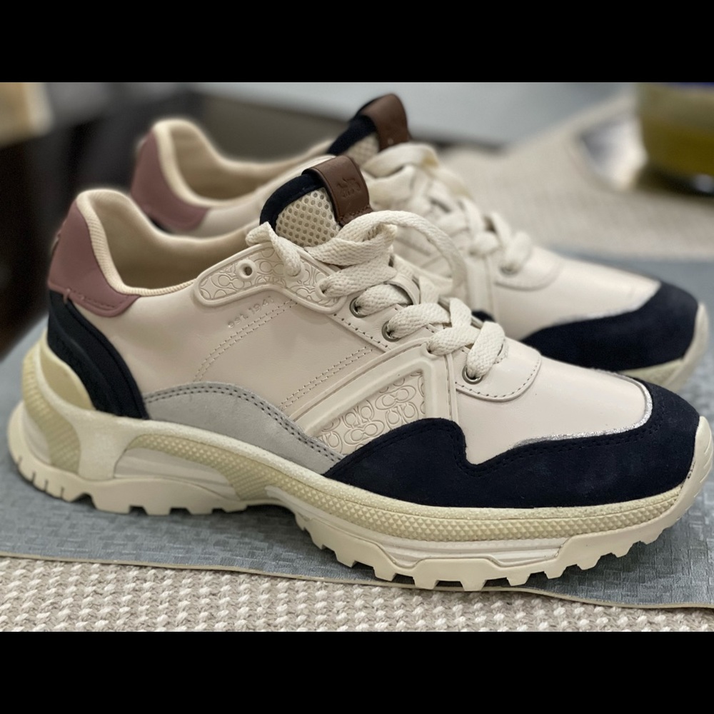 New coach sneaker .. the front color is like a navy blue ..